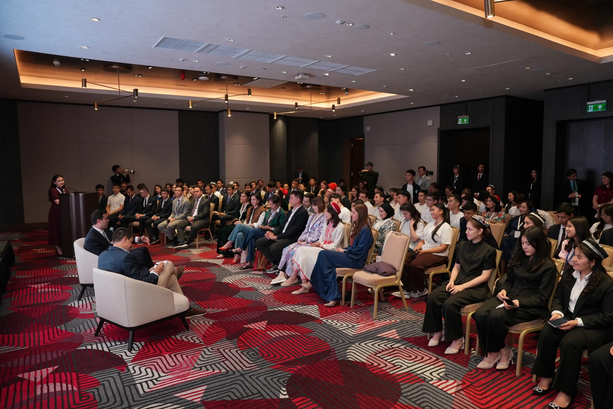 Young participants in conversation with speakers at a World Youth Platform dialogue session.